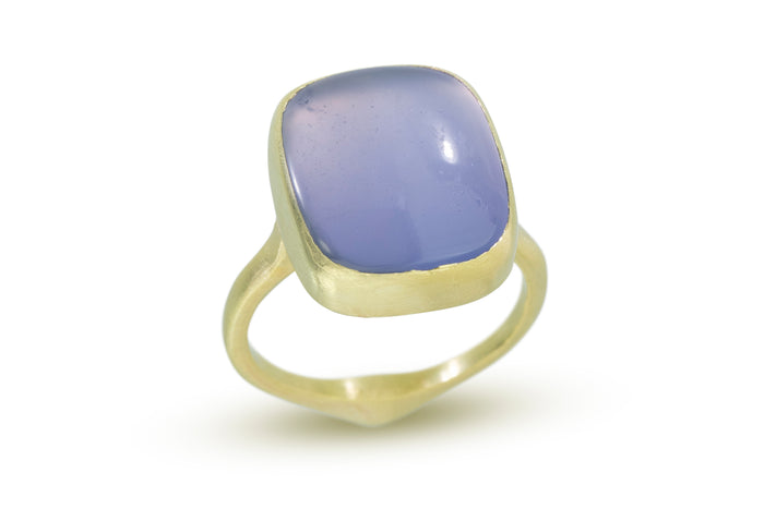 periwinkle blue rectangular smooth stone set in 18k gold ring